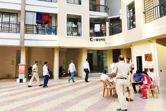 Police speak to neighbours at Bachraj paradise, Virar, where Koladkar was allegedly murdered by Sharma