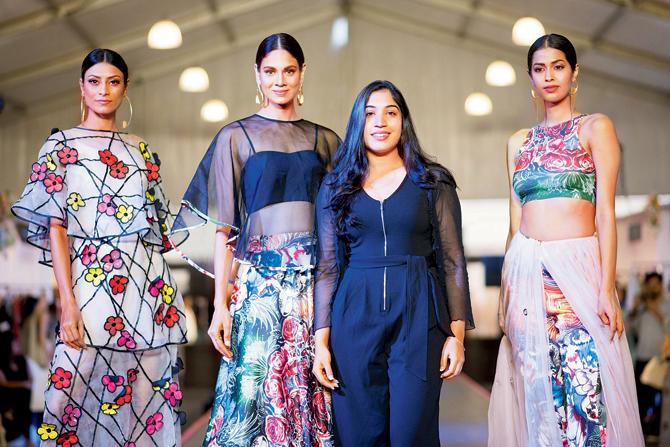 Salita Nanda (in black) poses with models sporting her Ophelia collection