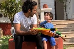 Watch video: An excited Taimur Ali Khan giggles as he plays his guitar
