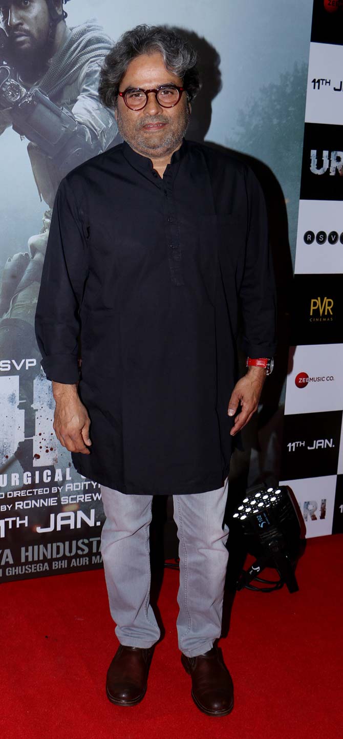Vishal Bhardwaj poses for the photographers at the special screening of Uri at Juhu, multiplex.