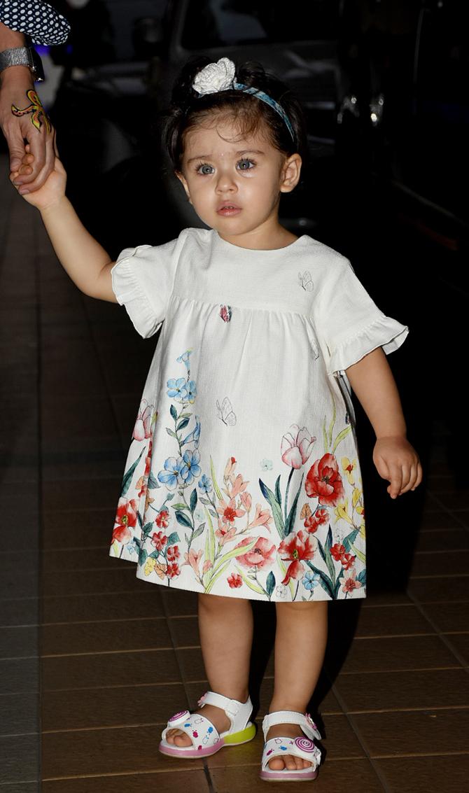 Inaaya Naumi Kemmu looked no less than a doll in this floral white baby dress, paired with baby sandals and a hair-tie. 