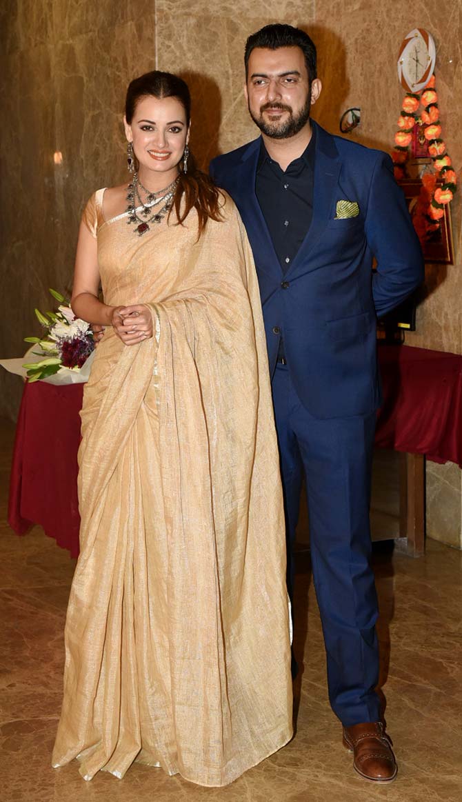 Dia Mirza looked pretty in her saree and husband Sahil Sangha looked dapper in his blue suit as they posed for the photographers.