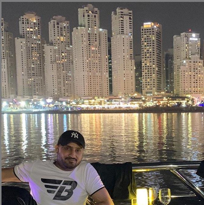 Harbhajan Singh looks relaxed in this picture with the Dubai skyline in the background. He is looking casual in a white t-shirt and black cap.