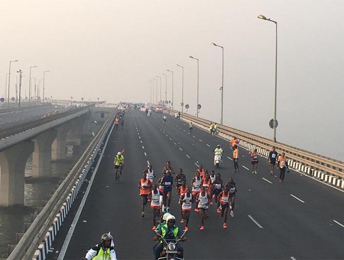 The initial part of the elite men's category of full marathon saw Kenyan runners dominate their counterparts. But slowly and gradually as the pack of elite runners moved towards Bandra Worli Sea Link (BWSl), Ethiopia's Aychew Bantie, bib no 5 took over the Kenyan runners after 16 kms of the run. Pic credit/ Twitter Tata Mumbai Marathon