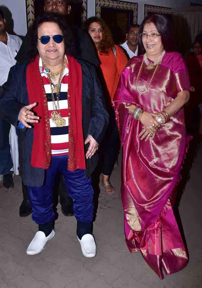 Bappi Lahiri posed with his wife Chitrani at Sameer Anjaan's daughter Suchita Pandey's wedding reception, held in Juhu, Mumbai.