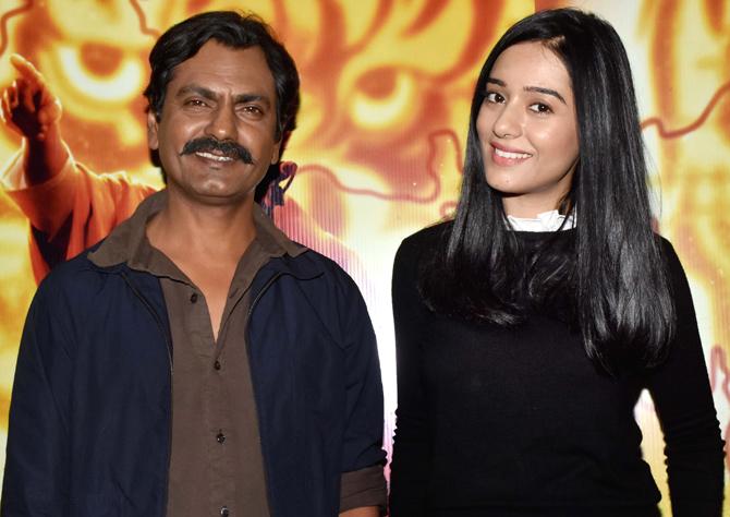 Nawazuddin Siddiqui and Amrita Rao pose for the shutterbugs at the screening of their film Thackeray in Juhu, Mumbai.