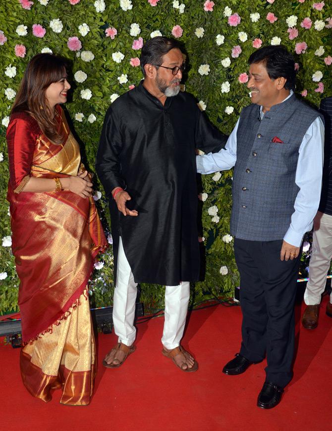 Mahesh Manjrekar and Medha Manjrekar in a candid conversation with former CM of Maharashtra, Ashok Chavan at the wedding reception.