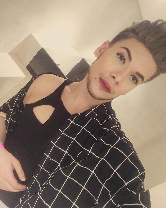 Faizy Boo loves taking selfies and here is one of his selfies where he is seen posing with his body-con top, bright red lipstick and perfectly waxed eyebrows.
