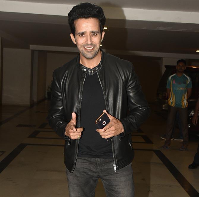 Anil Charanjeett happily posed for the photographers at Simmba success bash which was hosted by Karan Johar at his Bandra home.