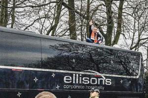 Blackpool fan stages protest on roof of Arsenal's team bus