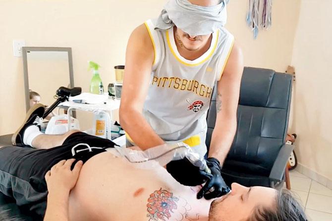 In Brazil, a blindfolded man attempted a tattoo using a tattoo gun