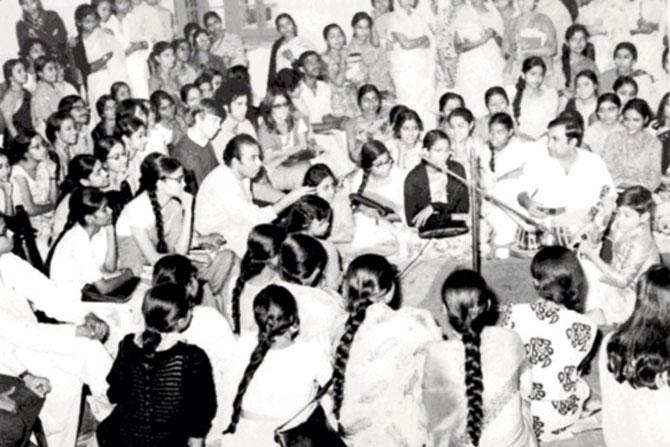 Sitting on the extreme right, seven-year-old Khan plays the sitar at a public concert in Kolkata