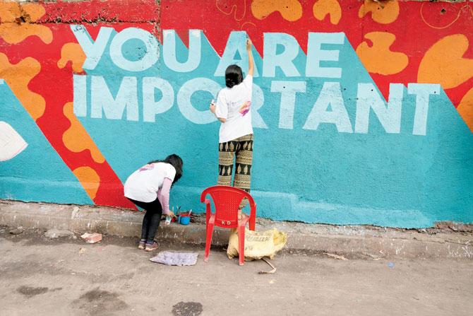 The barren walls flanking SV Road in Bandra being painted