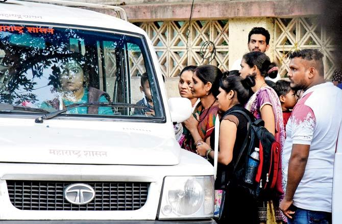 The families of the accused seen outside a Borivli court on Friday pleading with Assistant Conservator of Forests Girija Desai to let their arrested kin go