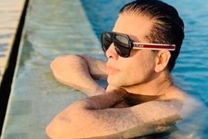 Karan Johar's picture chilling in the pool is making noise