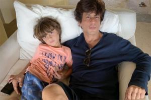 This photo of SRK and AbRam lazying on a couch is winning the internet