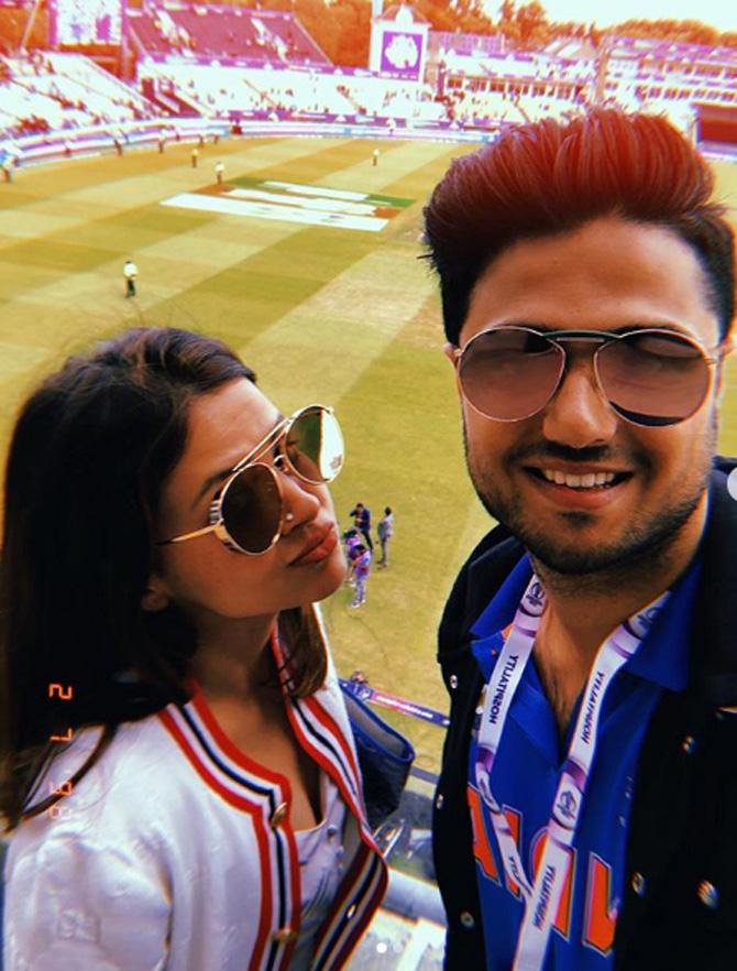 Sakshi Dhoni and MS Dhoni are very close to Kabir Bahia and his family.
Sakshi Dhoni took time out when the play was halted during an India game, to click a selfie with Kabir Bahia.