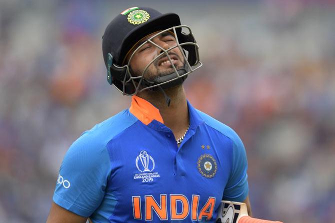 India's Rishabh Pant walks off for 32 during the 2019 Cricket World Cup first semi-final between New Zealand and India at Old Trafford in Manchester, northwest England