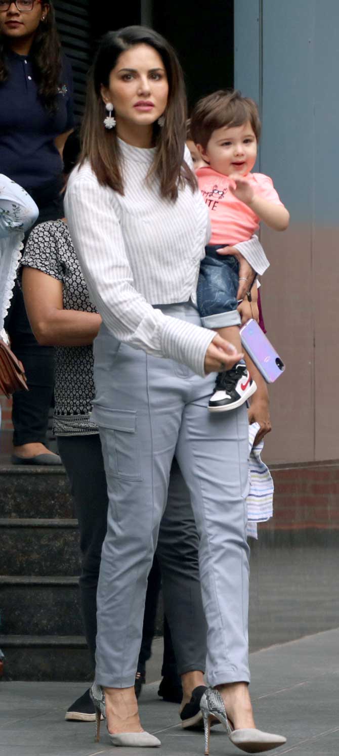 Sunny Leone was spotted with husband Daniel Weber and kids - Nisha Kaur Weber, Asher Singh Weber and Noah Singh Weber in Juhu, Mumbai. The family was out on a stroll in the city. All pictures/Yogen Shah