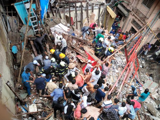 After cutting through iron beams, spreading the wooden planks and removing debris using hydraulic cutters, spreader and power tools, which took around an hour and a half, the fire brigade officials continued their rescue operation