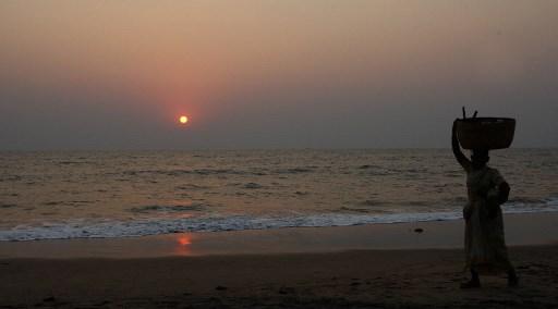 In February 2008, a half-clad body of a 15-year-old Scarlett Keeling from North Devon, United Kingdom was found at Anjuna beach, Goa. Initially, the Anjuna Police had tried to cover up the matter by stating it as a drowning case but the second autopsy report confirmed Keeling's rape and death due to a drug overdose.
In pic: An Indian fisherwoman walks near the place where the body of British teenager Scarlett Keeling was found on Anjuna beach in Goa.