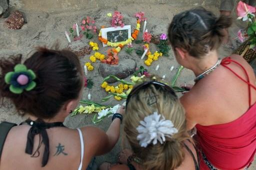 In pic: Tourists and friends of British national Scarlett Keeling sit around an impromptu memorial built-in her memory on her first death anniversary at Anjuna beach in Goa.