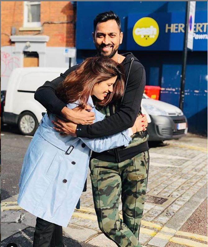 Krunal Pandya was being the dutiful brother to Hardik Pandya during the World Cup by visiting the UK along with wife Pankhuri Sharma to cheer Hardik on.
Krunal Pandya posted this picture of himself with wife Pankhuri Sharma and captioned it as, 