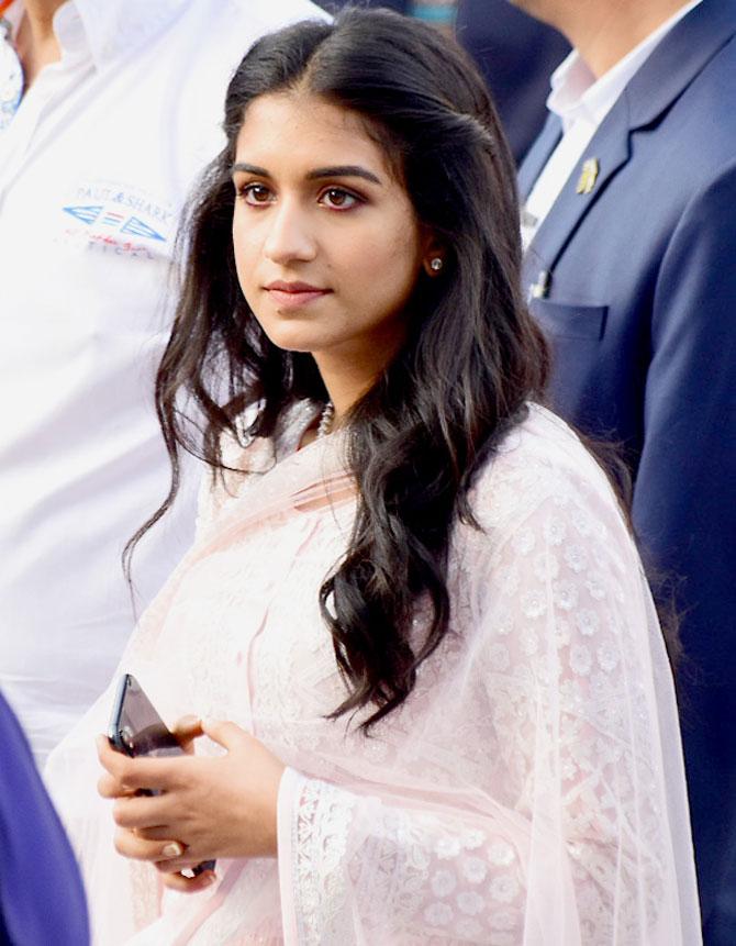 During the inauguration of Dhirubhai Ambani Square at Jio World Centre in Mumbai, Radhika Merchant stole the show in a pretty pink embroidered suit. She paired her suit with a zari dupatta and pink pants. She appeared in minimal makeup and half-tied hair. Her ensemble was coordinated with a pearl choker necklace