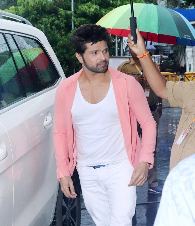 Himesh Reshammiya along with wife Sonia Kapoor was spotted at Siddhivinayak Temple in Prabhadevi, Mumbai. After unveiling the teaser of Happy Hardy And Heer on Guru Purnima, Himesh unveiled his film's first song, Heeriye, to coincide with his 46th birthday. Given that the film is a musical, the makers found it apt to promote the song, before unveiling the trailer. All pictures/Yogen Shah