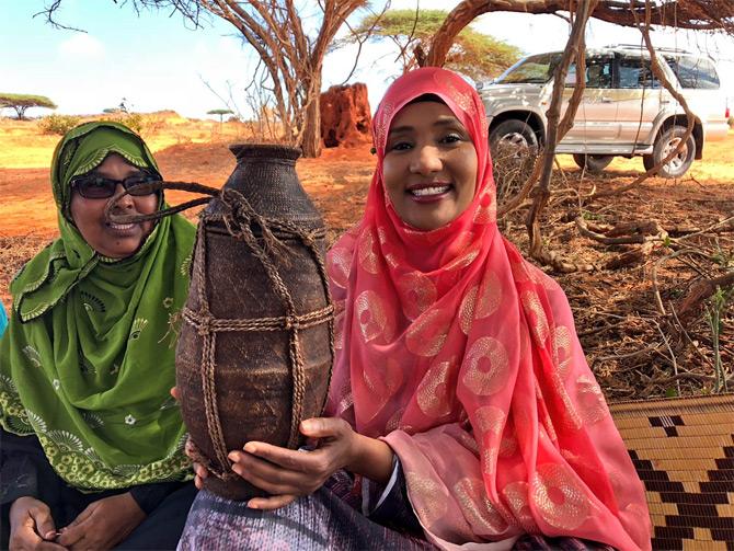 Hodan Nalayeh arrives in Kismayo, Somalia as a single mother of two boys. A divorcee, Hodan found love once again when she met Farid Jama Suleiman, a former minister, and businessman, the two married each other in 2018 in Nairobi.
In pic: Hodan Nalayeh holds a Somali milk container used by the nomads.
