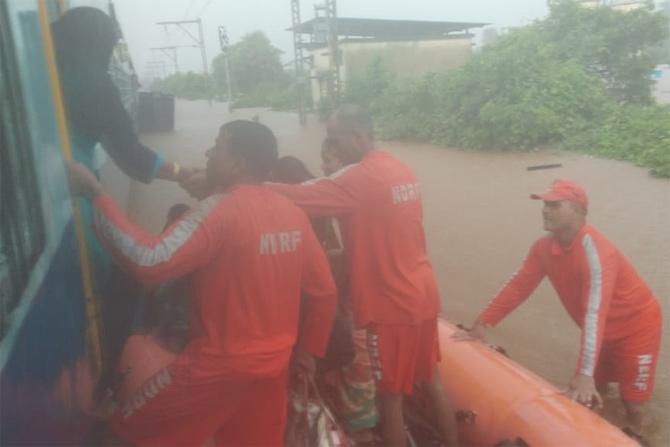 As per latest reports, eight NDRF boats (six inflated, two more being inflated) along with Railway personnel had reached the spot and began rescue operations. 
In pic: RPF officials conducting rescue operations