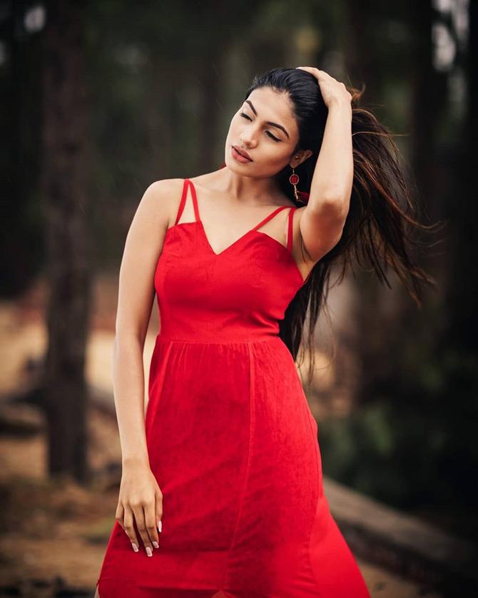 Urvi Shetty has always made a mark with her chic, glam and fabulous fashionista choices. From effortlessly carrying off a two-piece red monokini to rocking the party look in a red dress, Urvi has been giving major fashion goals with by rocking the colour of love.
In pic: Urvi Shetty is seen running her hands through her hair as she looks effortlessly carries the colour red.