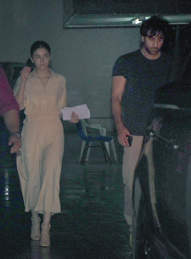 Ranbir Kapoor and Alia Bhatt were snapped at old Dharma office in Bandra, Mumbai. The actress was seen wearing a beige coloured formal dress, whereas Ranbir Kapoor opted for a black t-shirt and track pants for the outing. All pictures/Yogen Shah