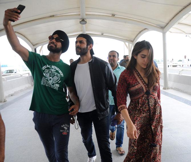 The yet untitled film is set to release in February 2020. Jio Studios, Dinesh Vijan's Maddock Films, Imtiaz Ali and Reliance Entertainment's Window Seat Films will present the film.
In picture: A fan tries to click a selfie with Kartik Aaryan and Sara Ali Khan at Chandigarh Airport.