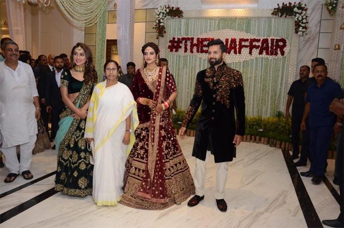 Nusrat Jahan and Nikhil Jain entered their wedding reception with none other than West Bengal Chief Minister Mamata Banerjee and Nusrat's best friend forever and newly-elected MP Mimi Chakraborty.