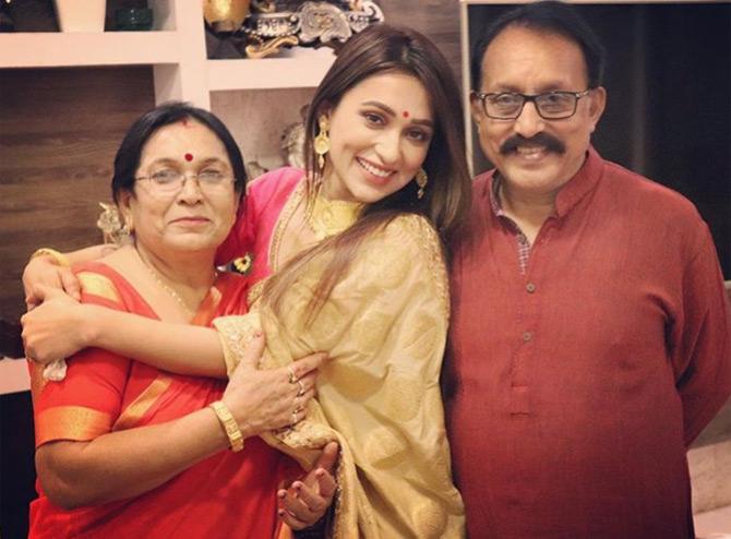 Did you know? Mimi Chakraborty, who is well-known for her work in Bengali cinema and the television industry was listed as the most desirable woman in the Calcutta Times list of Most Desirable Women 2016.
In photo: Mimi Chakraborty shared this beautiful and candid picture with her parents Arun and Tapashi Chakraborty on their 33rd wedding anniversary.