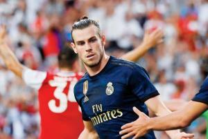 Besieged Gareth Bale scores in Real Madrid's 3-2 win over Arsenal