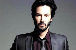 Keanu Reeves surprises family that made 'Breathtaking' sign for him