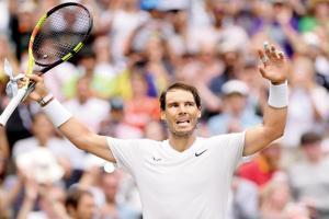 Wimbledon: Rafael Nadal marches on with win at Jo-Wilfried Tsonga