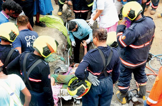 A 14-year-old girl, Sanchita Ganore, who was pulled out alive from the debris, died in hospital a few hours later. Pic/Satej Shinde