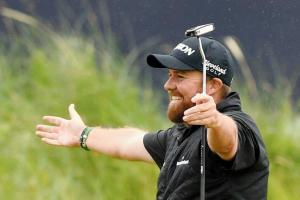 Shane Lowry weathers storm to win first Major