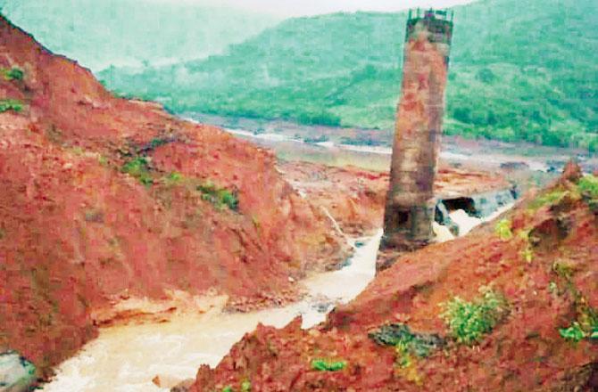 Tiware dam was ready for operation in 2004 and according to locals, on Tuesday, a major crack was seen in the main embankment before it collapsed. Pic/courtesy NDRF, Pune