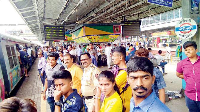 Shiv Sena MLA from Borivli Prakash Surve (in yellow shirt), takes the train to Bandra along with his secretary and security personnel as it cuts his commute by 75 minutes