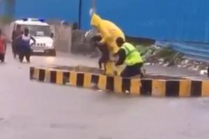 Watch Video: Mumbai police rescues drowning dog from monsoon deluge