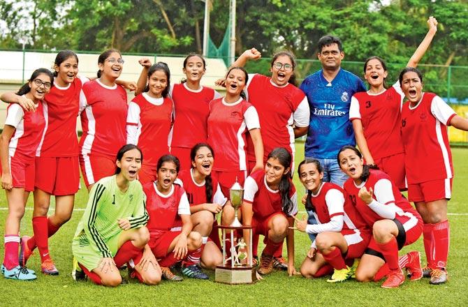 While girls champs Arya Vidya Mandir pose with the trophy at Cooperage yesterday. Pics/Suresh Karkera
