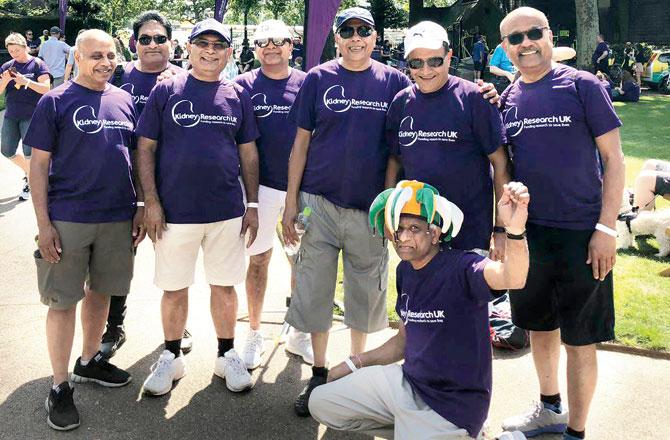 Mahesh (kneeling) and his fellow Patels from Essex Friday Club, after participating in a charity walk covering nine bridges in London last month