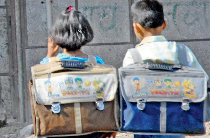 The BMC every year provides students of municipal schools with a kit that includes uniform, shoes, raincoat etc. Representation picture