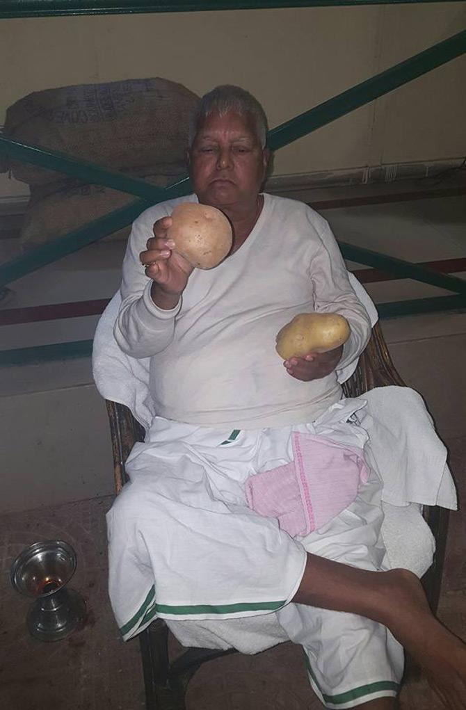 In pic: Lalu Prasad Yadav inspects potatoes which came fresh from his farms.