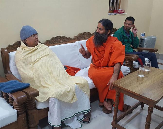 Lalu Prasad Yadav and his wife Rabri Devi ruled the state of Bihar for 15 long years from 1990 to 2005. Amidst all this, Lalu also served in the Rajya Sabha until 2004. In the 2004 Lok Sabha elections, Lalu Prasad Yadav's party won 21 seats and became the second-largest member of the UPA 1 after the Congress party. The master politician became the Railway Minister under Dr, Manmohan Singh's government.
In pic: Lalu Prasad Yadav interacts with Yoga guru Baba Ramdev.