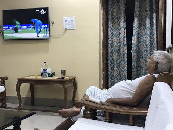 In pic: RJD chief Lalu Prasad Yadav enjoys the game of cricket between India and Pakistan. He captions the pic: Rain God bowling another spell of rain. We need rain here in India as its extreme hot out here and very important for the next crop season. #INDvPAK